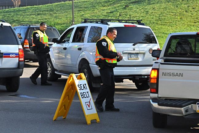 VICTOR IZZO/SPECIAL TO THE TIMES NEWS At the L.B. Morris Elementary School in Jim Thorpe on Wednesday morning, members of the Jim Thorpe Police Department conducted a seatbelt check and handed out flyers informing drivers about Pennsylvania's…