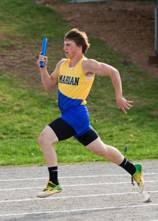 STEVE SHINKO/Special to THE TIMES NEWS Marian's Dylan Quirk runs the last leg of the boys' 400m relay against Shenandoah during Tuesday's track meet at Marian.