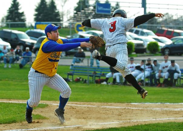 steve shinko/special to the times news Marian's Jim Stavinski tags out Tri-Valley's Tad Ney during a run down play between third base and home plate.