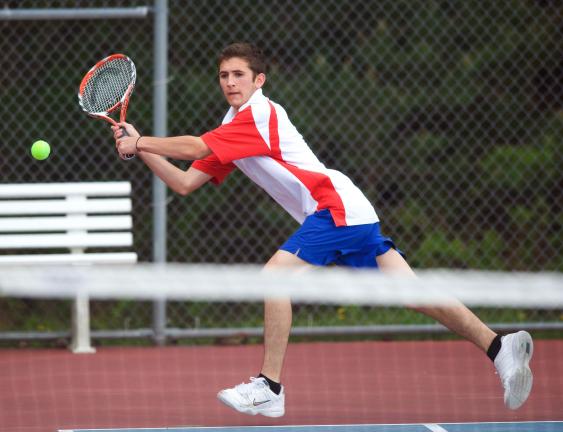 bob ford/times news Jim Thorpe's Zach Ligenza stretches to backhand a shot against Moravian Aacademy.