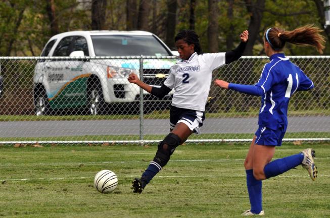 MIKE FEIFEL/TIMES NEWS Brianna Riddick of Northern Lehigh takes a shot on goal as Palmerton's Jill Farkas moves in to defend.