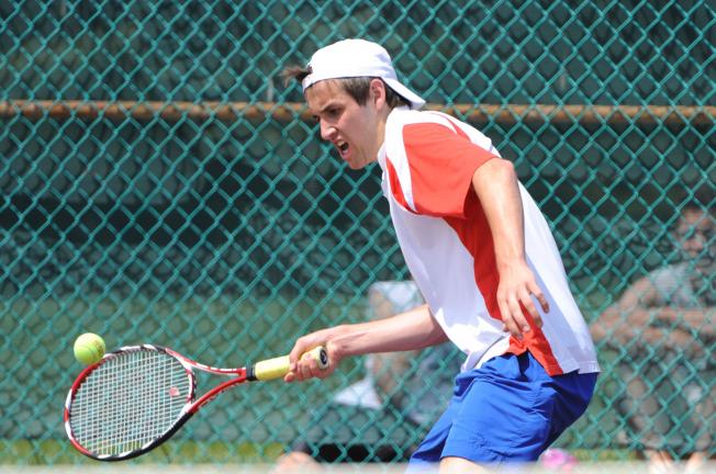 NANCY SCHOLZ/SPECIAL TO THE TIMES NEWS Jim Thorpe's Sam Lux reaches to return a shot against Allentown Central Catholic's Labario Obeid during the District 11 Class AA tennis semfinals.