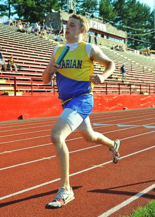 steve shinko/special to the times news Marian's Jamie Ramer finishes the last leg of the 1600 meter relay for a first place finish during the Schuylkill League team championships at Pottsville.