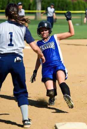 bob ford/times news Alura Bellis of Pleasant Valley slides safely into third base as Brittany Allivato of Pocono Mountain West awaits the throw.