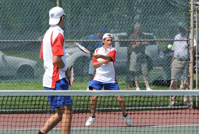 NANCY SCHOLZ/Special to THE TIMES NEWS Zach Ligenza returns a serve as his Jim Thorpe teammate looks on. The duo defeated Becahi to advance to today's quarterfinal round.