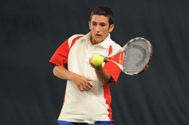 NANCY SCHOLZ/TIMES NEWS Jim Thorpe's Zach Ligenza returns the ball during the District 11 Class AA Doubles Tournament on Saturday.