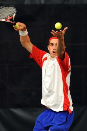 nancy Scholz/times news Jim Thorpe's Sam Lux tosses the ball in the air as he prepares to serve against Notre Dame.