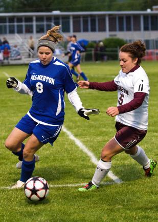steve shinko/special to the times news Palmerton's Sarah Andrews (left) tries to maintain control of the ball as Lehighton's Katrina Reppert closes in to defend.