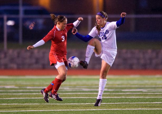 bob ford/times news Pleasant Valley's Kayla Dorney (right) and Angela Munoz of Pocono Mountain East battle for control of the ball.