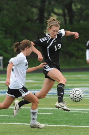 nancy scholz/special to the times news Northwestern's Haley Kubat (right) beats Katie Burns of Saucon Valley to the ball.