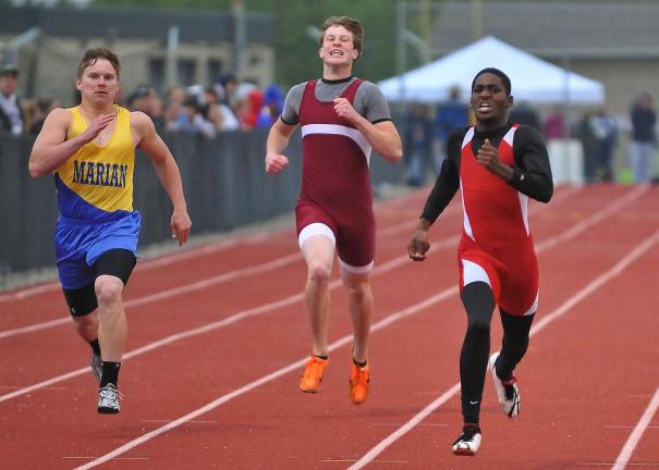 steve shinko/special to the times news Jim Thorpe's Kareem Mickens (right) finished first and Marian's Paul Martin finished second in the boys' 400 meter dash at the Schuylkill League Track Field Championships. In the center is Pottsville's Casey…