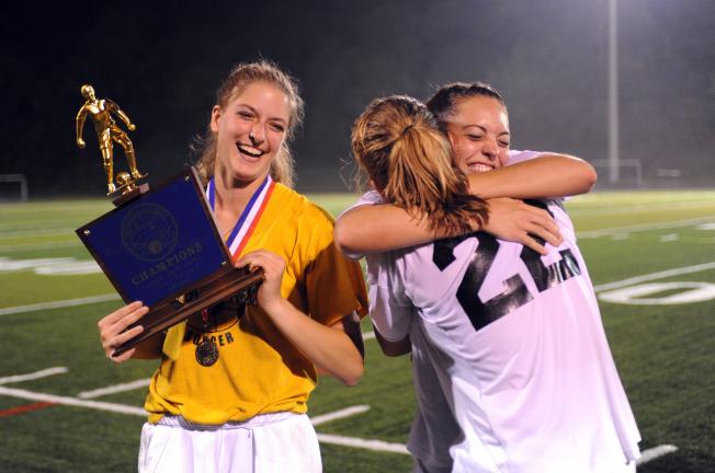 NANCY SCHOLZ/Special to THE TIMES NEWS Seniors Chelsea Ritter. Seneca Tucker and Emily Iobst celebrate after winning the Colonial League Girls Soccer Championship over Bangor by a 1-0 score.