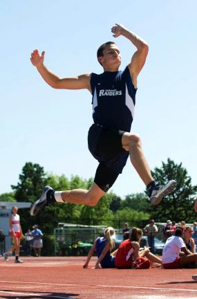 bob ford/times news Zach Lakitsky of Tamaqua leaps to a gold medal in the Class AA long jump.