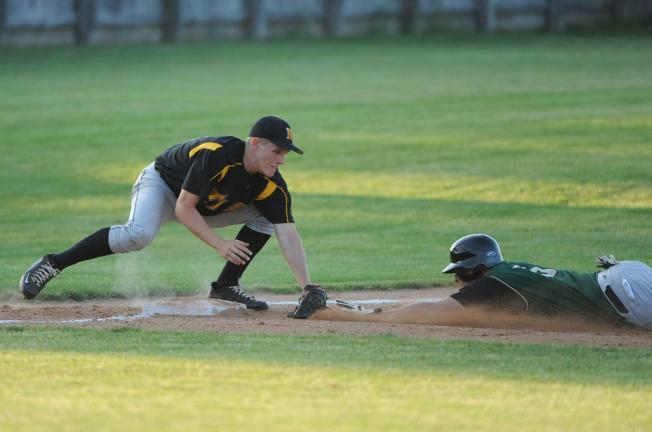 Nancy Scholz/Special to the TIMES NEWS Northwestern's Ty Cunningham puts the tag on a Central Catholic runner during Tuesday's district playoff game.
