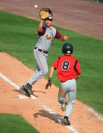 Bob Ford/TIMES NEWS Lehighton's Dave Behler reaches for a throw at first base to record an out on Saucon Valley's Keith Okken.