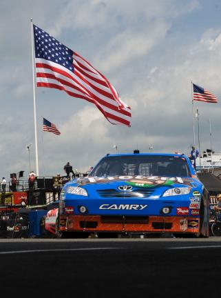 bob ford/times news  The car of Kyle Busch comes out of the garage before his qualifying run.