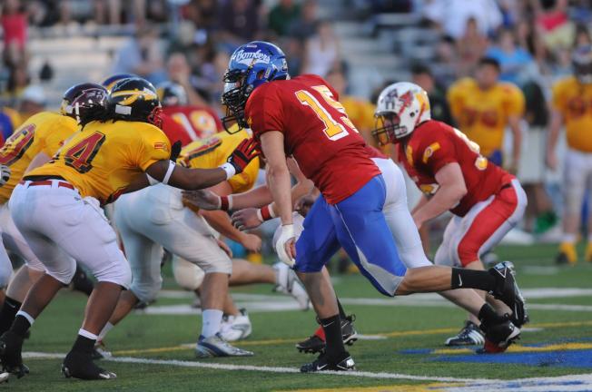 NANCY SCHOLZ/TIMES NEWS Palmerton's Joe Weber rushes the quarterback from his defensive end spot on the Red team during Thursday's All-Star game.
