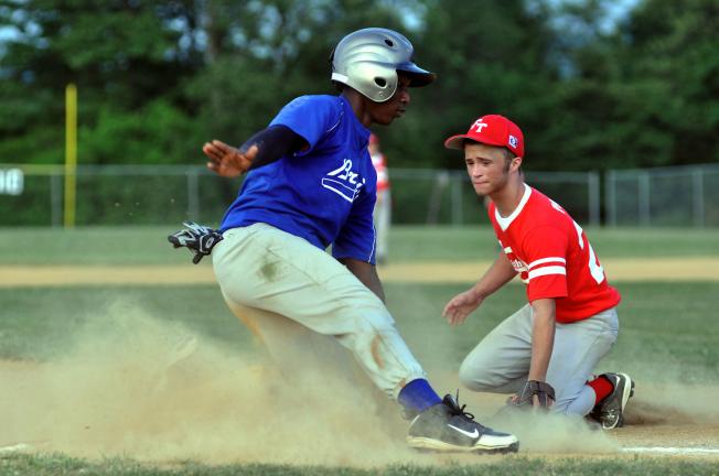 MIKE FEIFEL/TIMES NEWS Pat Divineaud of the Jim Thorpe Bruins slides safely around the tag of Jacob Hoats, Franklin Patriots third baseman.