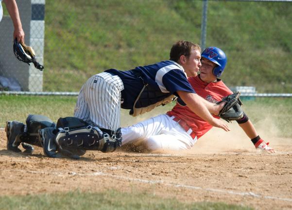 bob ford/times news Tamaqua catcher Tyler Milot dives to catch the ball as Brandon Sedesse of Valley West slides home safely with his team's first run.