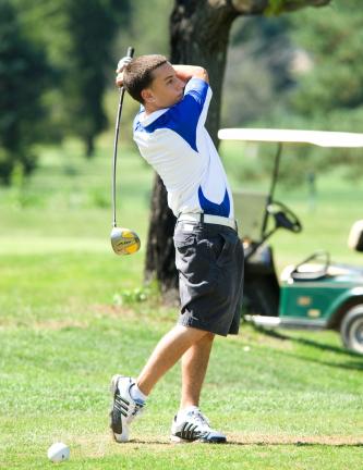 bob ford/times news Jim Thorpe's Dean DiBonifazio follows through after a tee shot. during Friday's match.