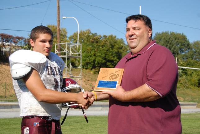 Lehighton junior quarterback Josh Agosto, left, receives congratulations from head coach George Ebbert for being named the TIMES NEWS Football Player of the Week. Agosto completed 9-of-12 passes for 178 yards and three touchdowns in a 33-12 victory…