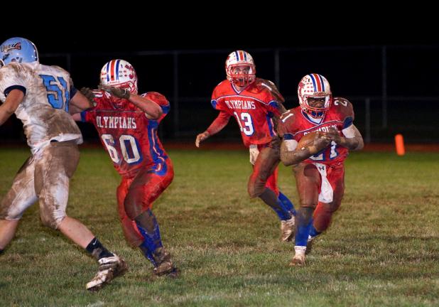 bob ford/times news Jim Thorpe running back Shane Edwards (27) takes the handoff from quarterback Sean Green (13) and runs behind a block thrown by Ryan Gregoire (60).