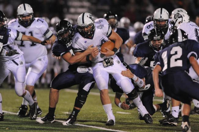 NANCY SCHOLZ/Special to THE TIMES NEWS Northern Lehigh's Matt Gill gets tackled by a Salisbury defender, but not before picking up some yardage.