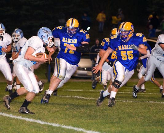 BOB FORD/TIMES NEWS Shenandoah Valley's Eric Whalen looks for running room with Brendan McGowan (72) and Anthony Pilla (55) in pursuit.
