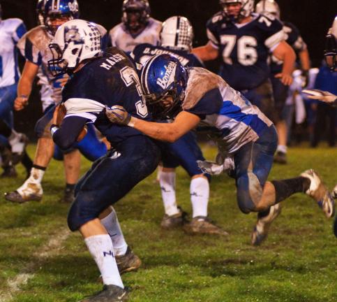 Patrick Deutsch/Special to the TIMES NEWS Northern Lehigh's Danny Marsh fights for some yards while Palmerton defender Alex Vignone tries to drag him down from behind.
