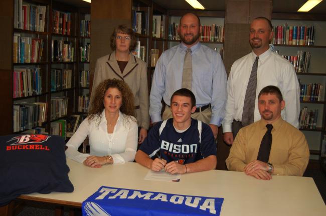 JOE PLASKO/TIMES NEWS Kolby Mashack (seated, center), a senior at Tamaqua Area High School, will continue his wrestling and academic careers at Bucknell University next year. Seated with Kolby are his parents, Sheila and Jon. Standing from left are…