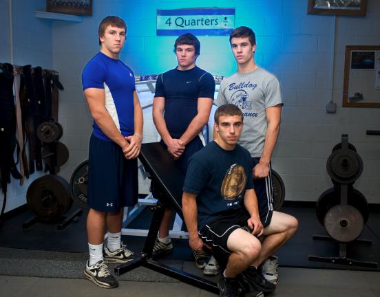 bob ford/times news Northern Lehigh's starting offensive backfield of quarterback Dylan Hofmann (seated); fullback Matt Gill (standing, left); tailback Cody Remaley (standing, center); and flanker Jake Kern (standing, right) are at home in the…