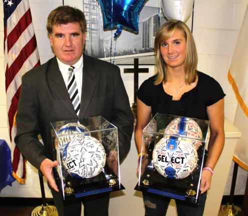 @Caption Stand Alone:Raider soccer award winners Two encased and signed soccer balls were presented at the recent Tamaqua Lady Raider banquet. The ball were given to senior Allsion Updike (right) for being the school's career scoring leader (88…
