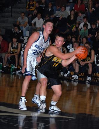 ron gower/times news Northwestern's Payton Bachman (14) looks for a teammate as Northern Lehigh's Devin Glose provides the defensive pressure.