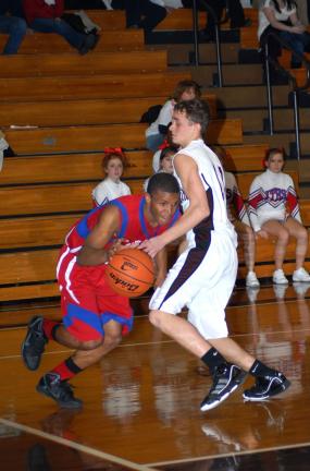 Jim Thorpe's PJ Coleman (left) tries to drive the baseline against Lehighton defender Nate Kresge.
