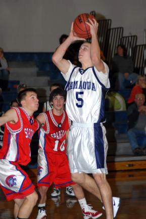 Ron Gower/TIMES NEWS Tamaqua senior Michael Streisel (5) makes a field goal, driving past North Schuylkill defenders Drew Hughes, left, and Damon Meyer. Streisel was the top scorer in the game, netting 21 points.