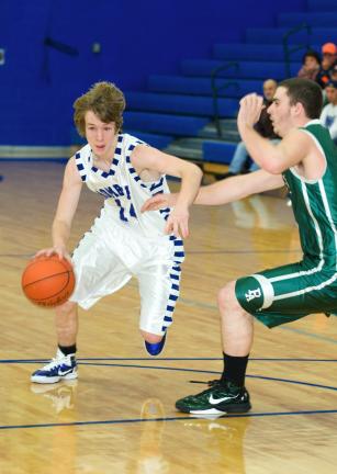 BOB FORD/TIMES NEWS Palmerton's Matthew Leaver dribbles the ball around Pen Argyl's Alec Heard as he looks to make a move to the hoop.