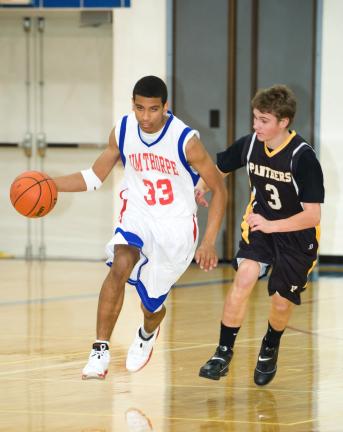 BOB FORD/TIMES NEWS Darius Clark (33) of Jim Thorpe brings the ball up court as Panther Valley's Mike Hadesty defends.
