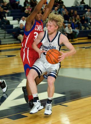 bob ford/times news Jordan Waylen (right) of Northern Lehigh takes the ball to the basket against Jim Thorpe's P.J. Johnson.