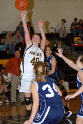 RON GOWER/TIMES NEWS Panther Valley's Britany Cunfer (40) scores two points. Behind her is Tamaqua's Amy Zehner (25) and in front of her is Allison Updike (34).
