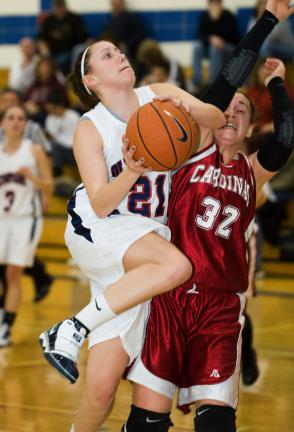 bob ford/times news Brittany Holland of Jim Thorpe goes strong to the basket against Pine Grove's Alicia Kimmel.