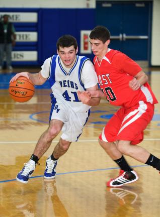 Pleasant Valley's Eric Wild (41) drives to the basket as David Garcia of Pocono Mountain East defends.