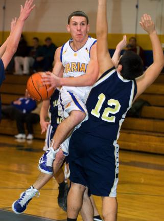 BOB FORD/TIMES NEWS Marian's Eric Baker drives to the hoop as Schuylkill Haven's Jesus Carmona defends.