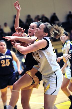 NANCY SCHOLZ/Special to THE TIMES NEWS Jessica Albright (front) of Northwestern battles to hang on to the ball as Notre Dame's Tara Gorman battles her for it.