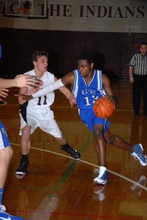 ron gower/times news Pleasant Valley's Selwin Wright (right) starts his drive to the basket as Lehighton's Nate Kresge (11) defends.
