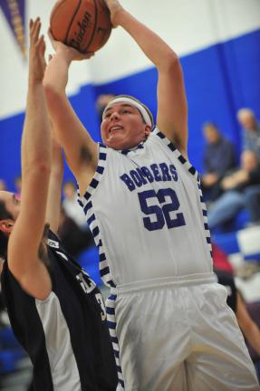 NANCY SCHOLZ/Special to THE TIMES NEWS Palemrton's Jourdan Reinhart goes up to take a shot from underneath as Salisbury's Sam Cochrane defends.