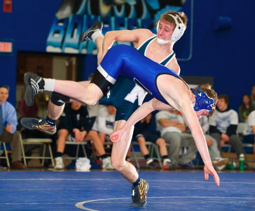 Northern Lehigh's Lucas Dise (standing) prepares to take down Dillon Masington of Palmerton. Dise went on to post a 7-4 decision at 119 pounds.