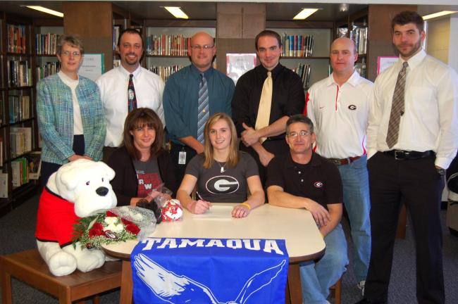 Tamaqua Area High School senior Allison Updike signs a letter of intent to continue her track and field career at the University of Georgia. Seated with Allison (front, center) are her parents, Jackie and Ralph Updike. In the back row are TAHS…
