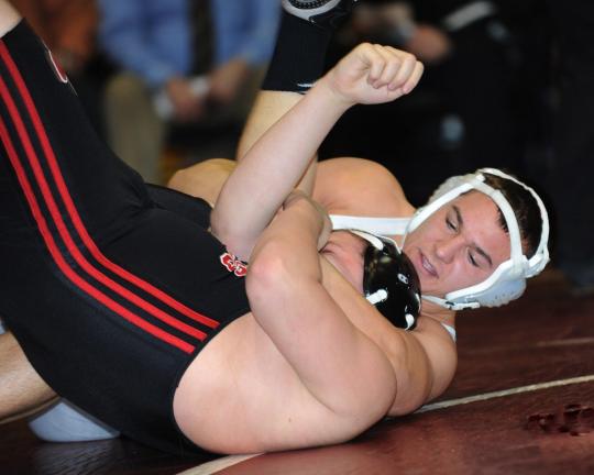 don herb/times news Garth Lakitsky of Tamaqua (white headgear) gets set to put the finishing touches on a pin of Tri-Valley's Mason White in the 215 pound bout. Lakitsky got the fall in 1:04.