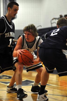 Mike Feifel/times news Northern Lehigh Tyler Dibilio (center) looks to escape a double team by Tamaqua defenders Matthew Kurek (left) and Tyler Krell.