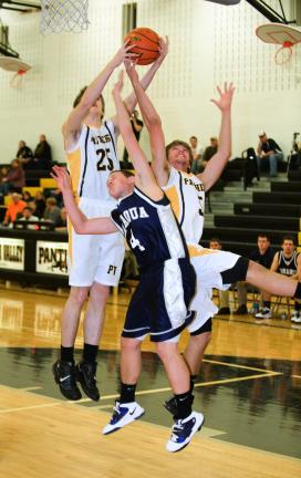 BOB FORD/TIMES NEWS Panther Valley's Nate Mathewson (25) goes high for the rebound as Tamaqua's Spencer Bennett (4) and PV's Zach Stanko also reach for the ball.